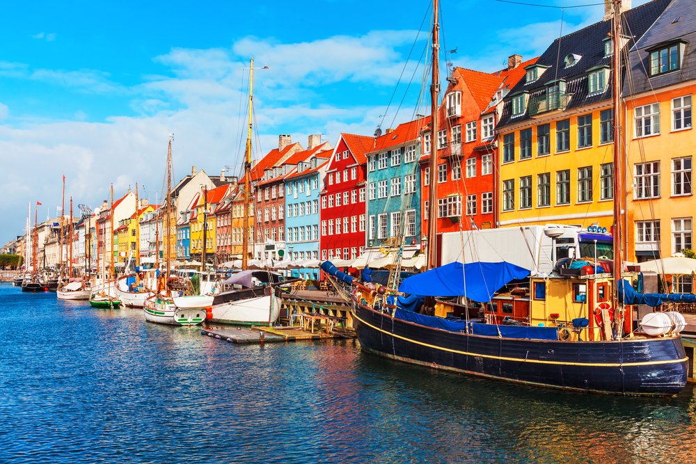 Nyhavn pier with color buildings, ships, yachts and other boats in the Old Town of Copenhagen, Denmark